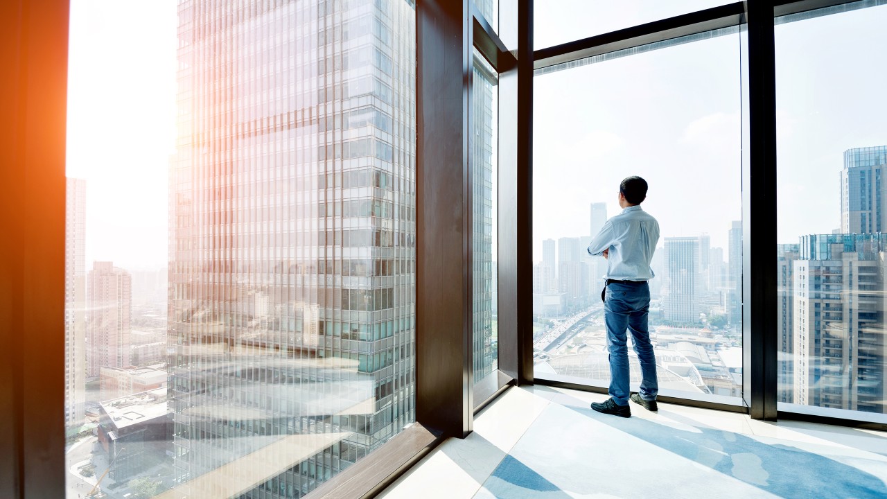 A businessman viewing the Hong Kong skyline