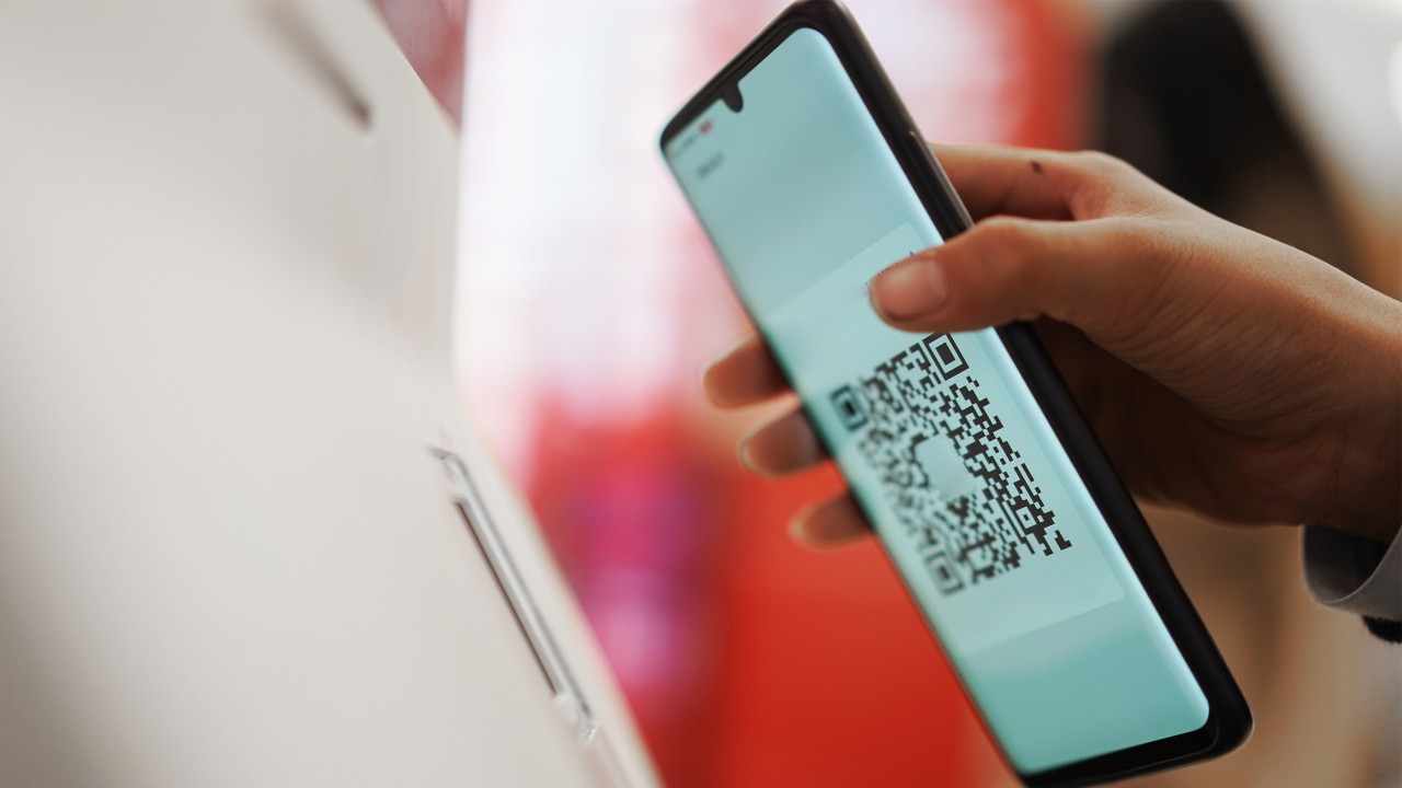 Scanning mobile QR code on the machine; image used for HSBC Credit Card.