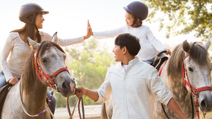 A family is riding horses; image used for HSBC Income Goal Deferred Annuity Plan page.