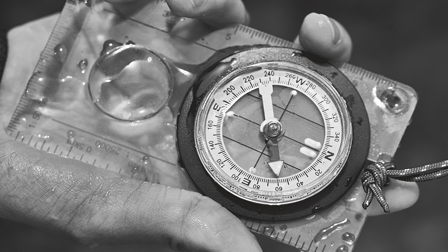 Holding compass; image used for HSBC Jade International Partner page. 