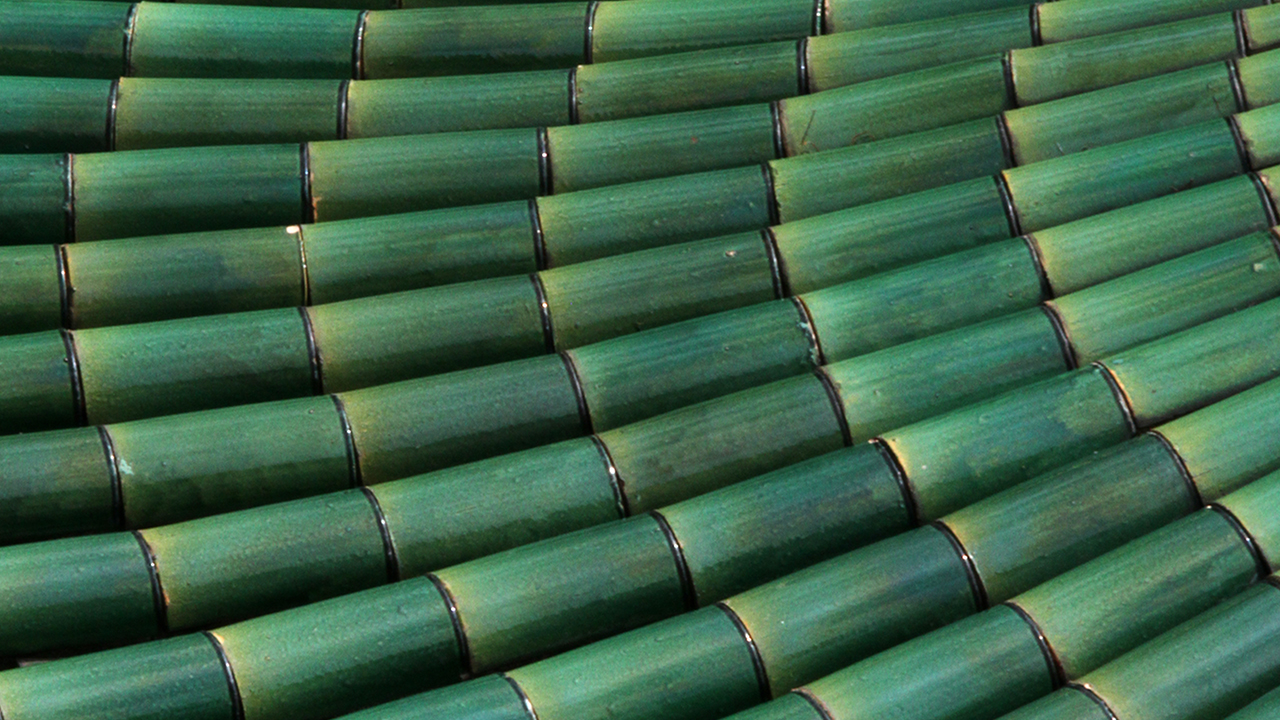 Emerald green roof tiles; image used for HSBC Jade Wealth Management Services.