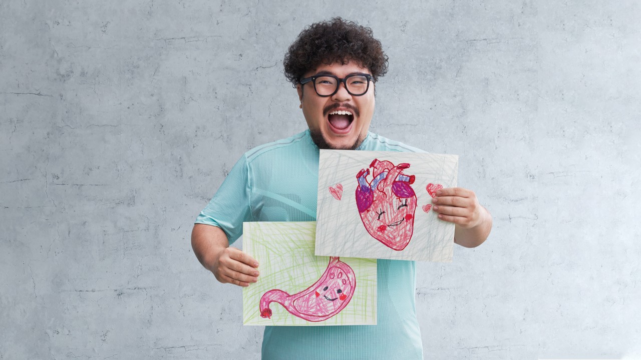 A man happily holding two pictures，Image used for first-year premium discount;