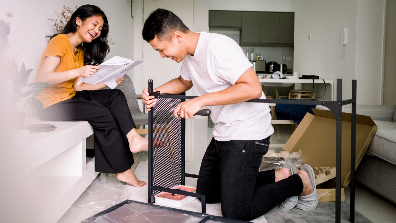 Couple are assembling the table;image used for "How to become financially independent" article.